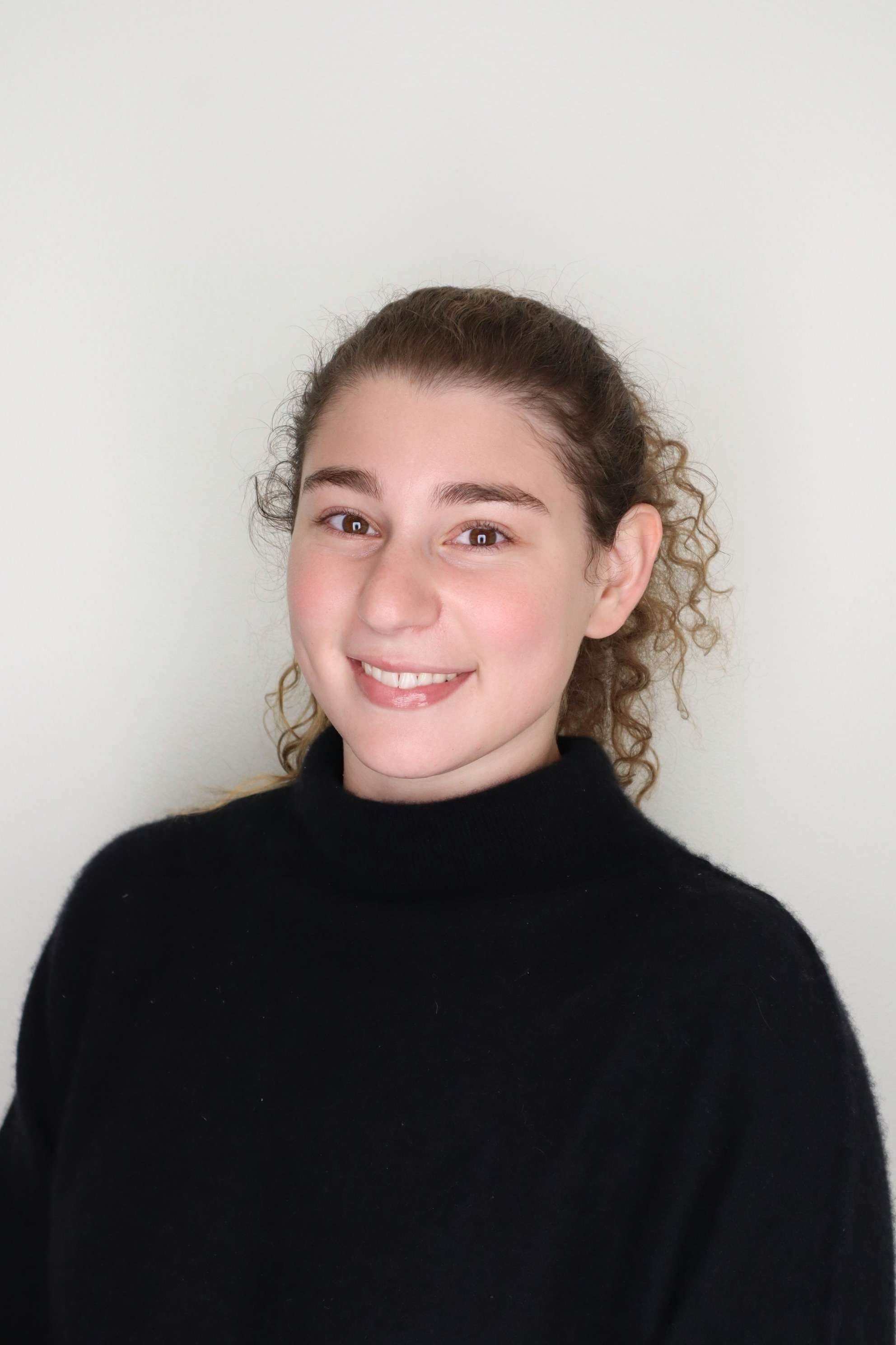 Headshot image against white background of Emma Perlstein